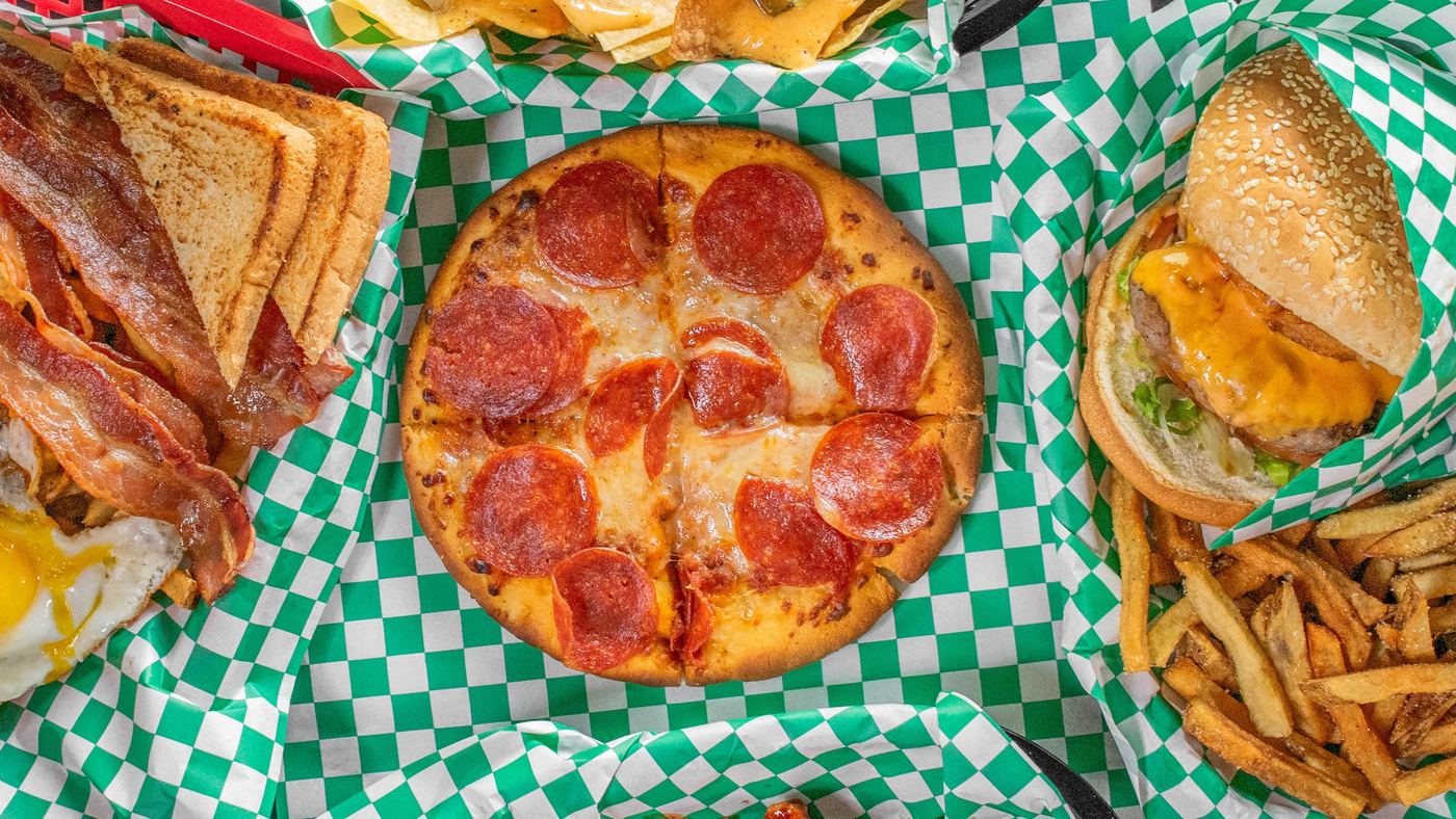 A spread of Kelly's Cafe burgers, pizza, nachos, wings and breakfast